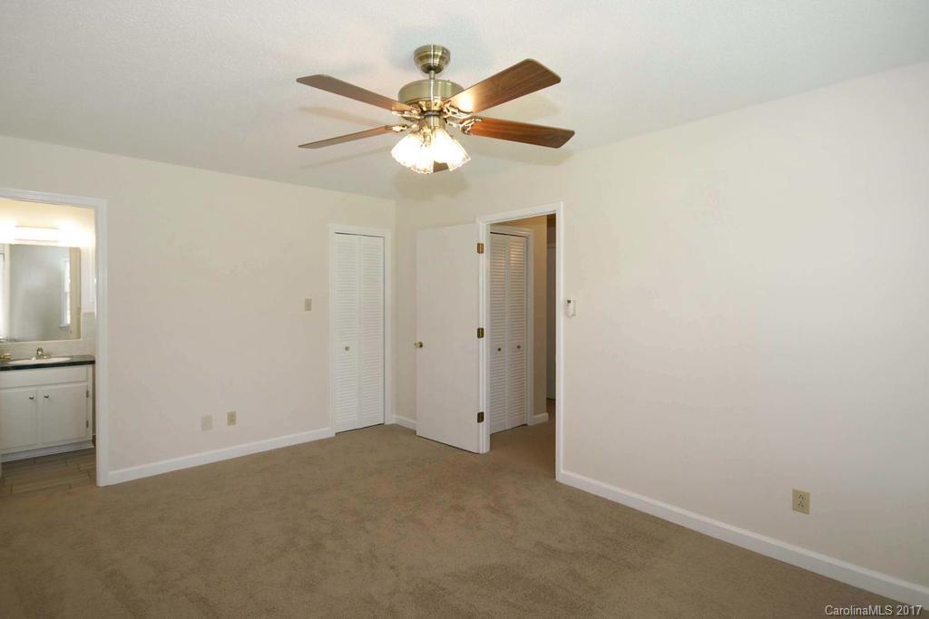 2 Old Farm Road Salisbury, NC 28147 - Photo 14 of 24 an empty room with closet and a chandelier fan