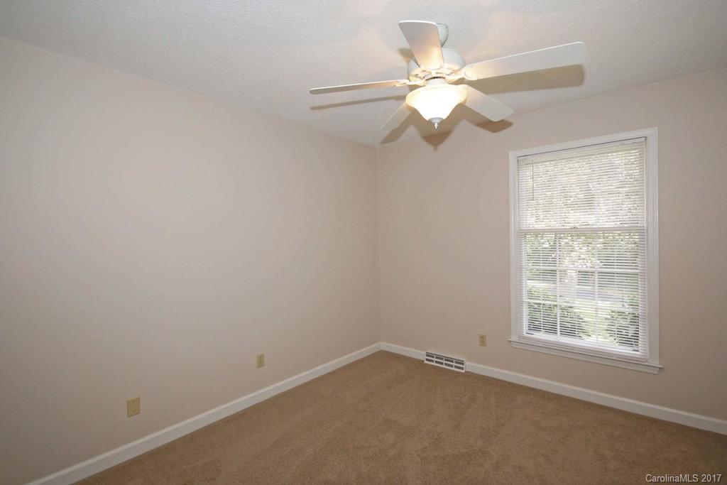 2 Old Farm Road Salisbury, NC 28147 - Photo 17 of 24 an empty room with a window and a fan