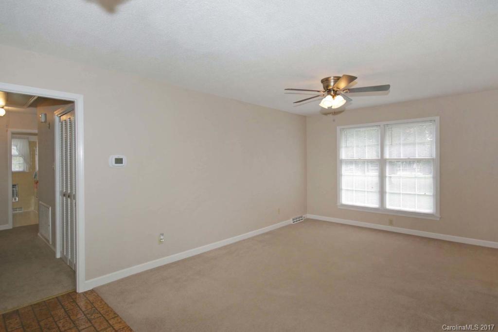 2 Old Farm Road Salisbury, NC 28147 - Photo 5 of 24 an empty room with windows and a chandelier