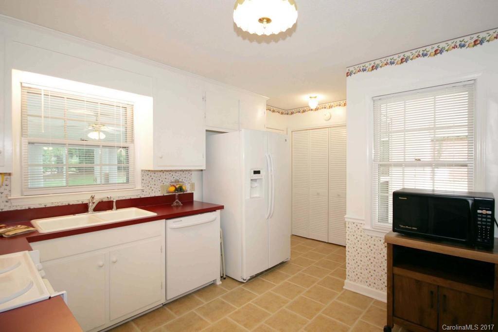 2 Old Farm Road Salisbury, NC 28147 - Photo 8 of 24 a kitchen with a sink and a stove top oven