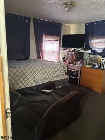 a room with furniture and a flat screen tv