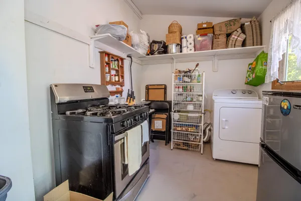 a kitchen with stainless steel appliances granite countertop a stove and a refrigerator