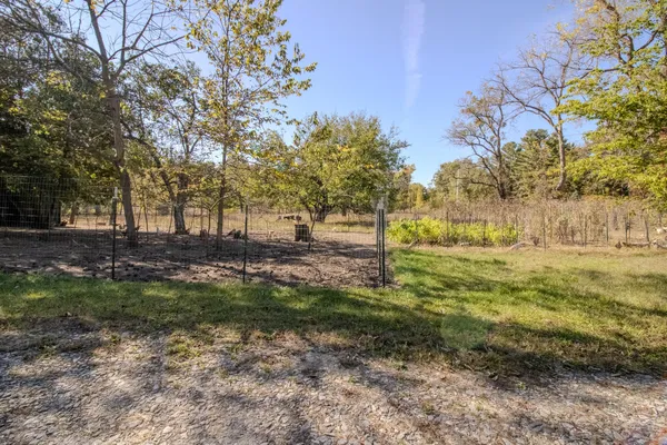 a view of backyard with green space