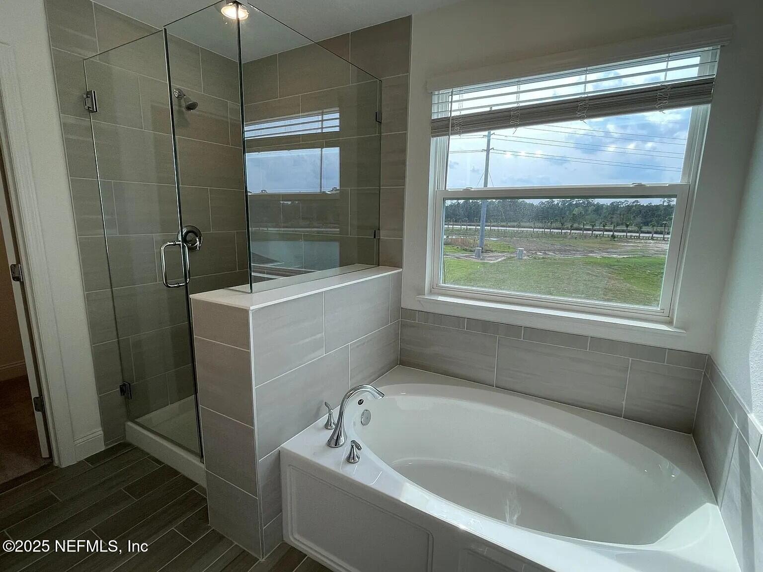 134 Varner Way St. Augustine, FL 32092 - Photo 13 of 30 a white bath tub sitting next to a window