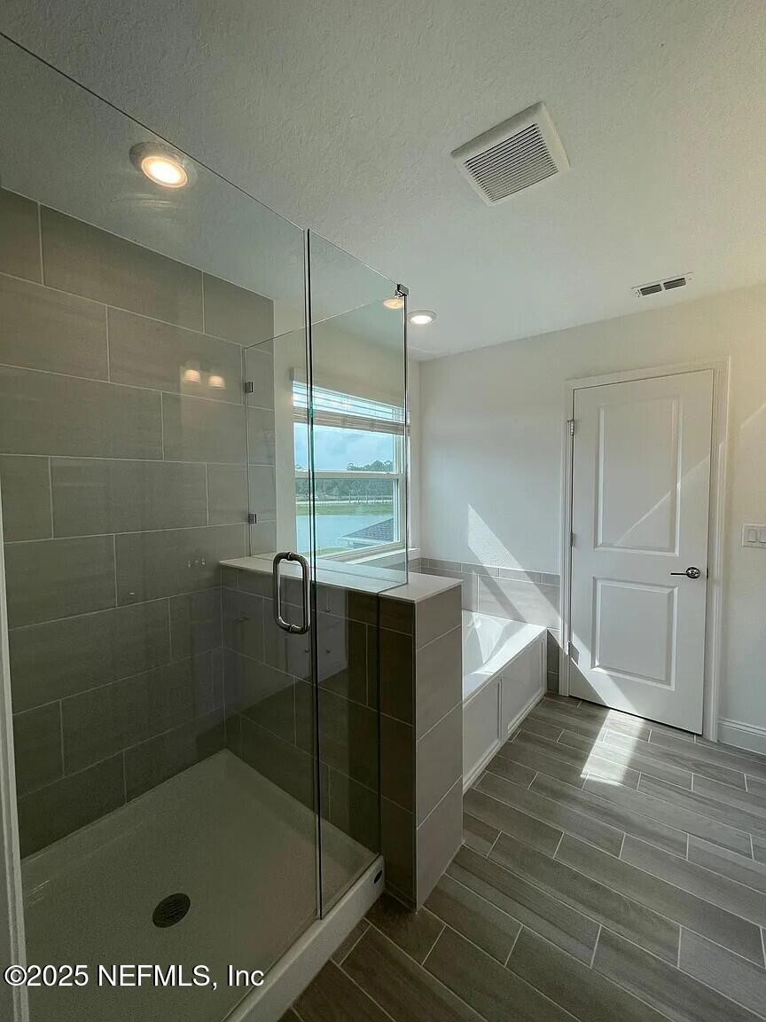 134 Varner Way St. Augustine, FL 32092 - Photo 14 of 30 a bathroom with a bathtub and a shower