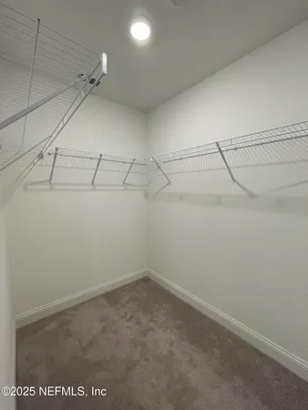 a view of a room with racks on the wall