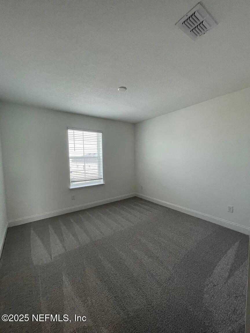 134 Varner Way St. Augustine, FL 32092 - Photo 19 of 30 an empty room with a window