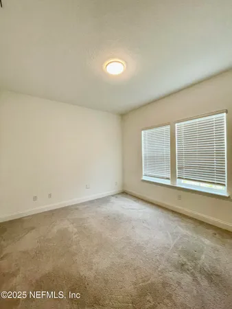an empty room with a empty space and window