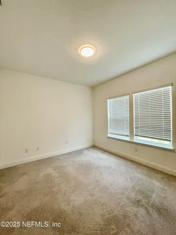 an empty room with a empty space and window