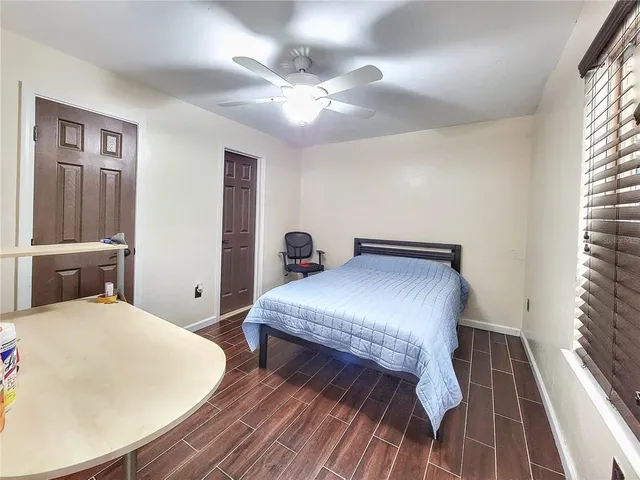 a bedroom with a bed and a table