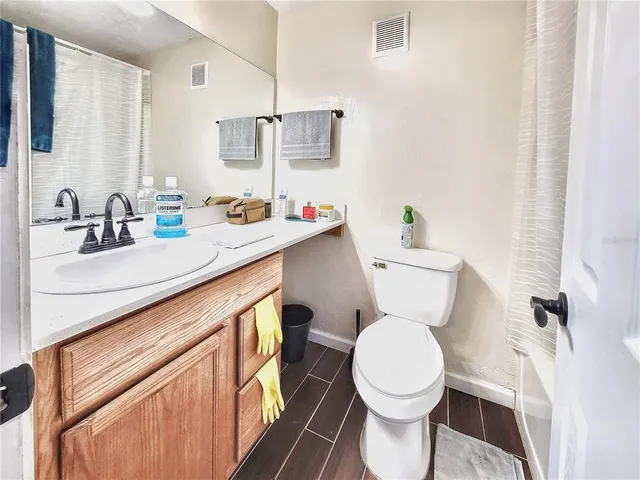 a balcony with wooden floor and outdoor space
