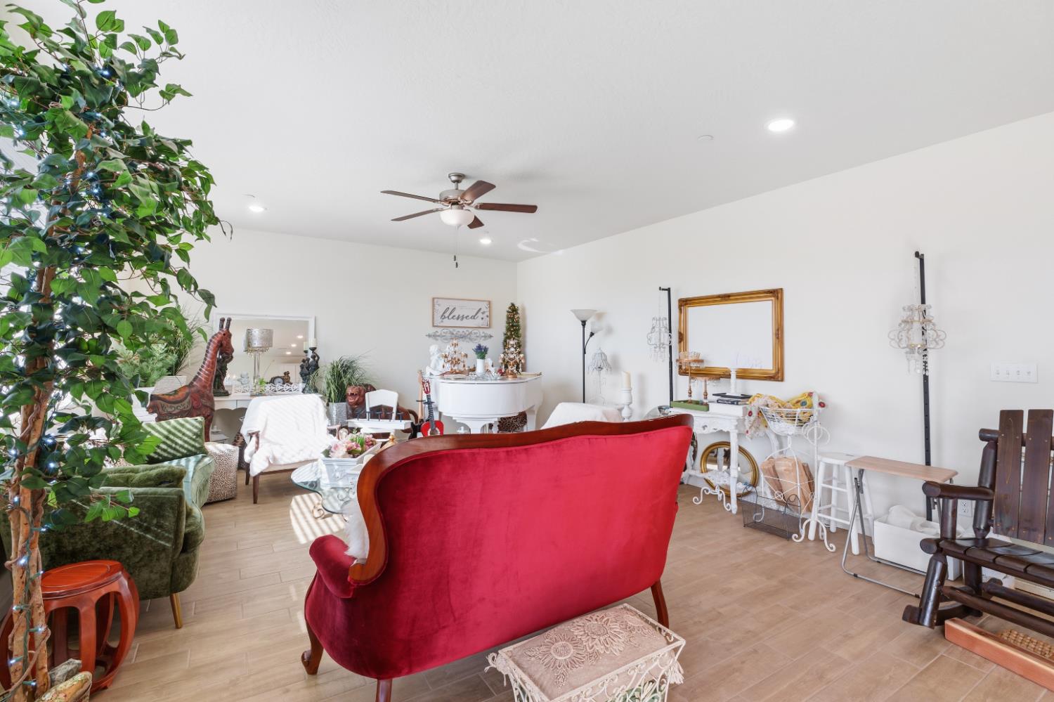 1617 North Filbert Avenue Fresno, CA 93727 - Photo 17 of 45 a living room with furniture a rug and a chandelier