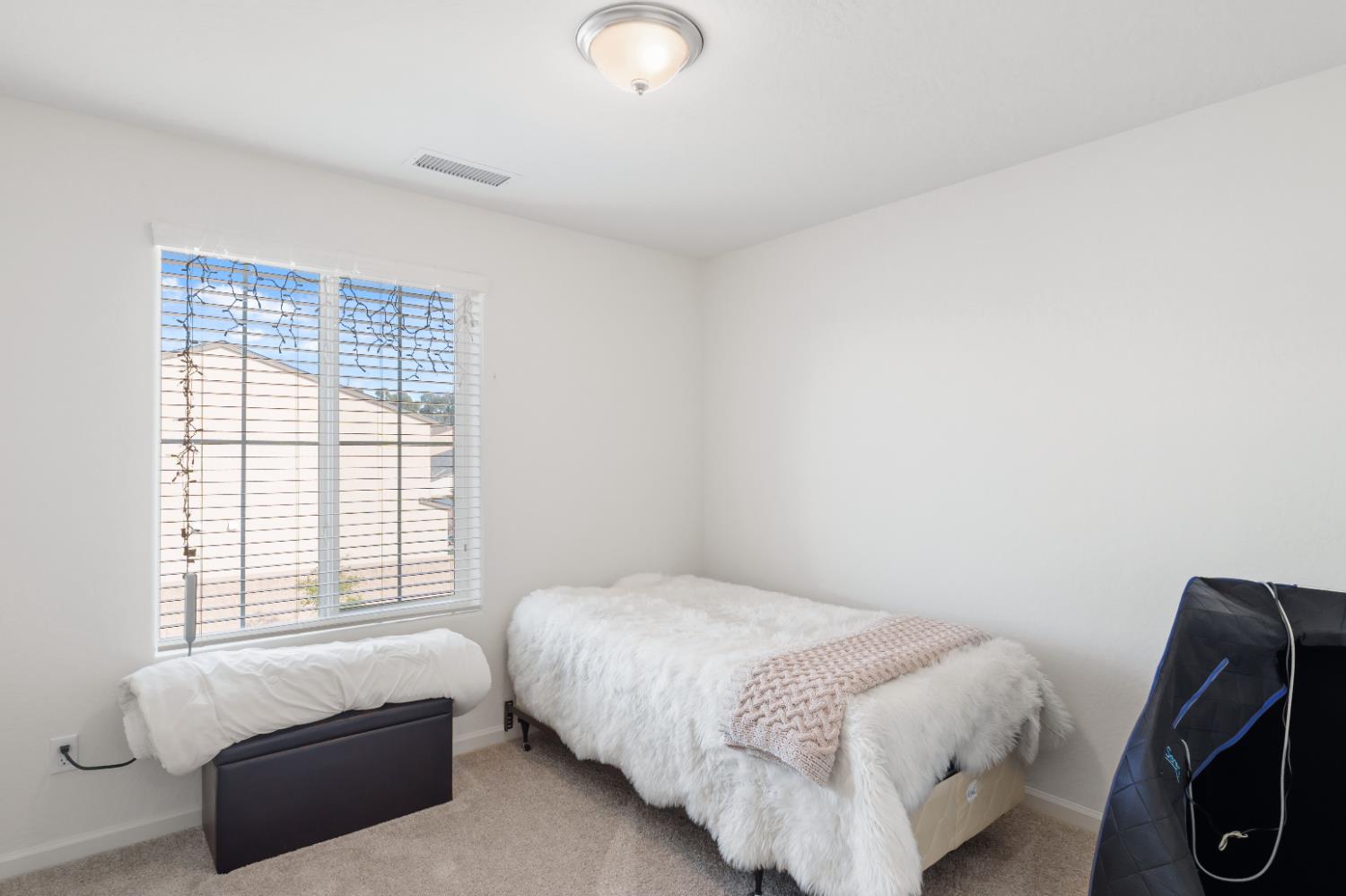 1617 North Filbert Avenue Fresno, CA 93727 - Photo 21 of 45 a bed room with a bed and a couch