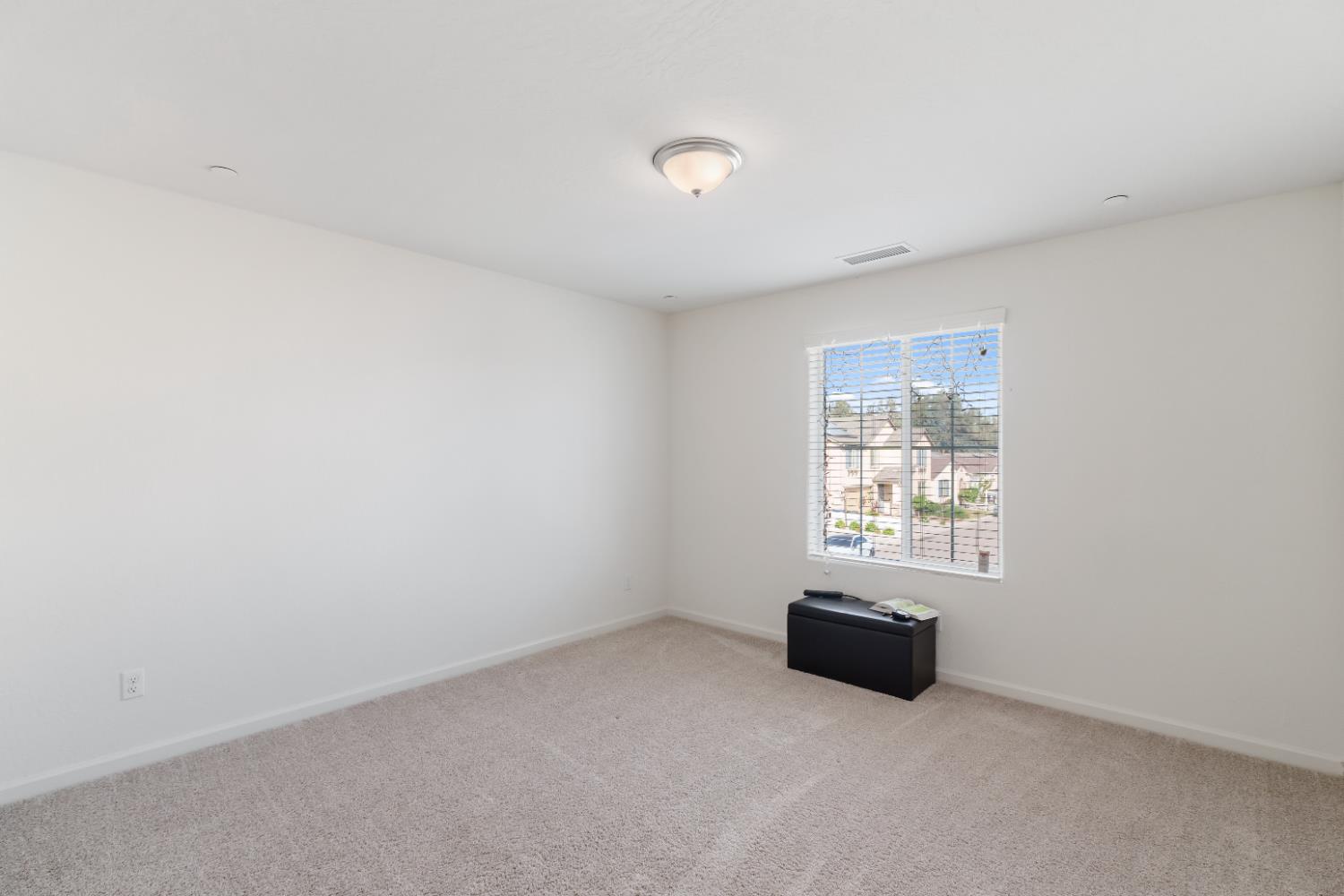 1617 North Filbert Avenue Fresno, CA 93727 - Photo 23 of 45 an empty room with windows