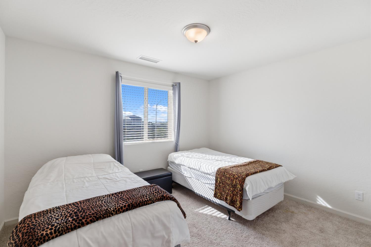 1617 North Filbert Avenue Fresno, CA 93727 - Photo 26 of 45 a bedroom with a bed and a window