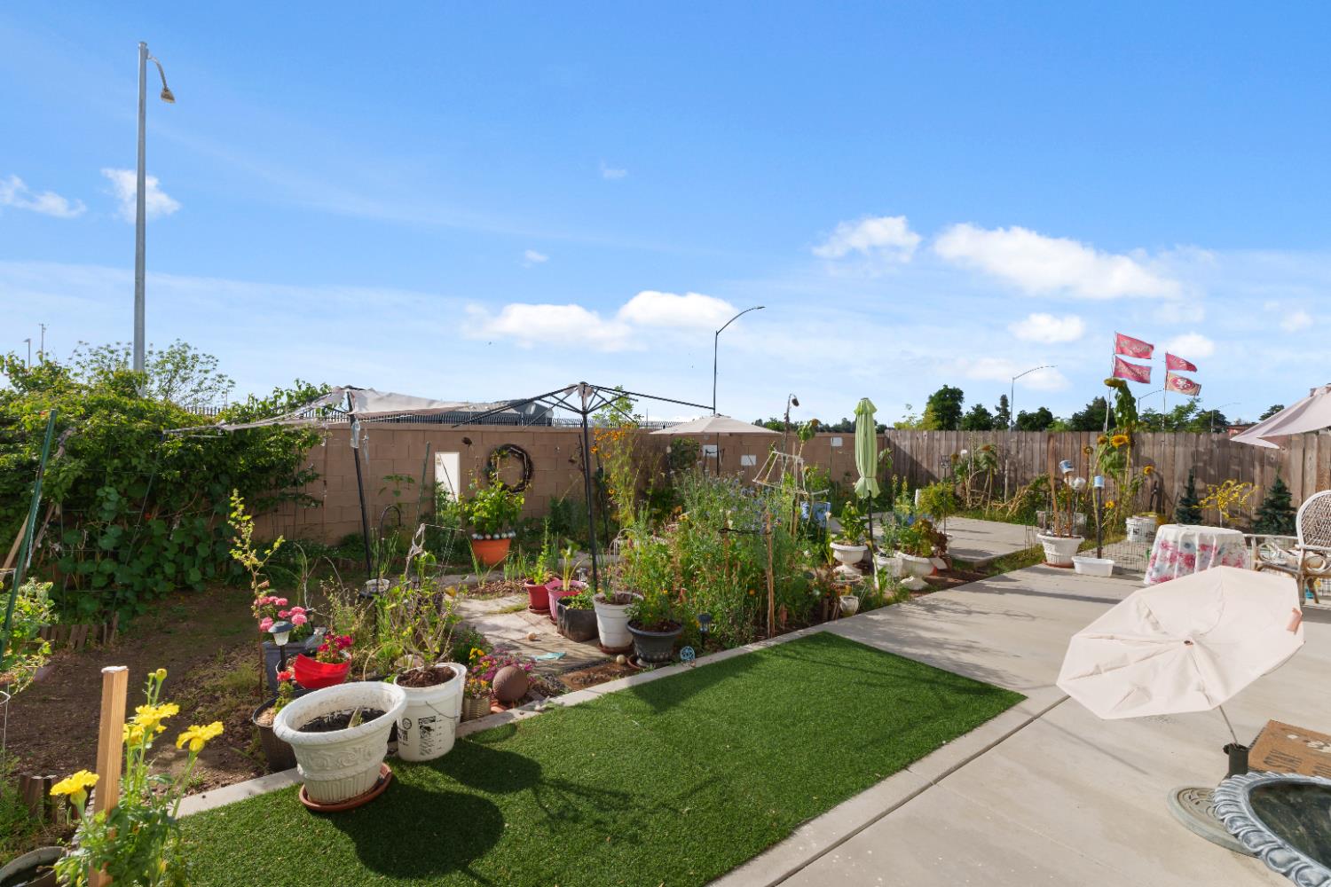 1617 North Filbert Avenue Fresno, CA 93727 - Photo 32 of 45 a view of a patio with couches table and chairs and potted plants