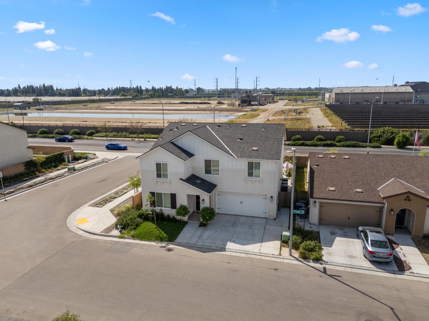 1617 North Filbert Avenue Fresno, CA 93727 - Photo 36 of 45 an aerial view of a house with a yard and lake view