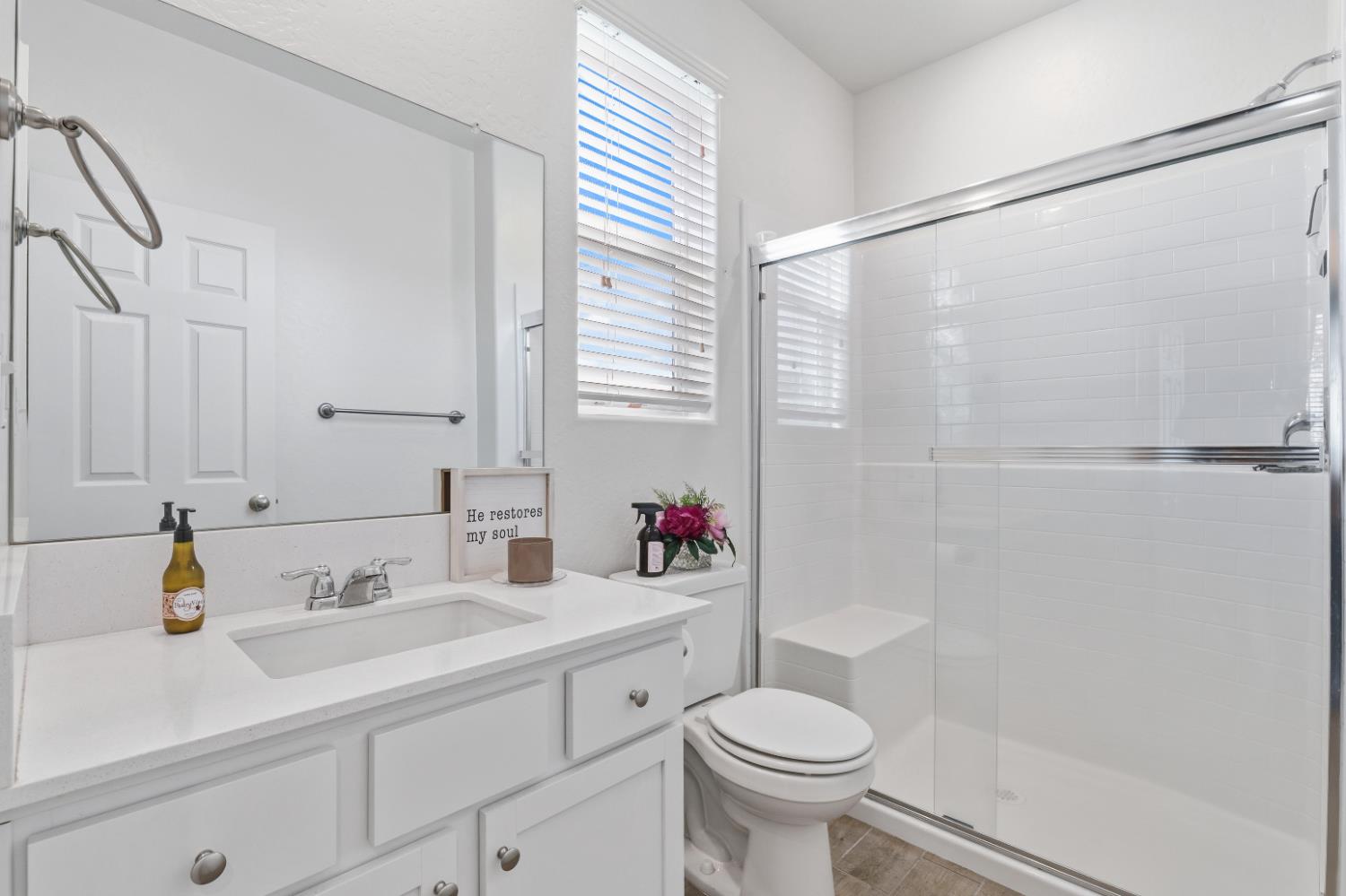 1617 North Filbert Avenue Fresno, CA 93727 - Photo 7 of 45 a bathroom with a sink a toilet and shower