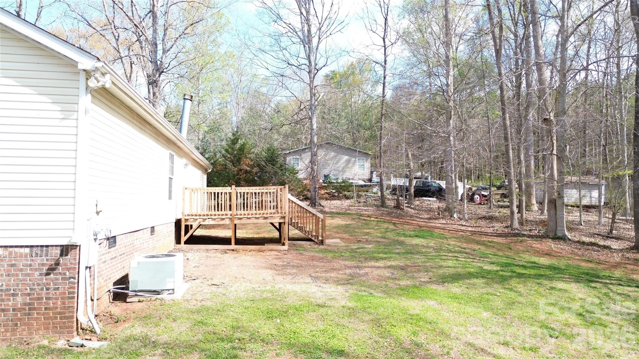 3441 Laboratory Road Lincolnton, NC 28092 - Photo 19 of 24 a view of a house with backyard and sitting area