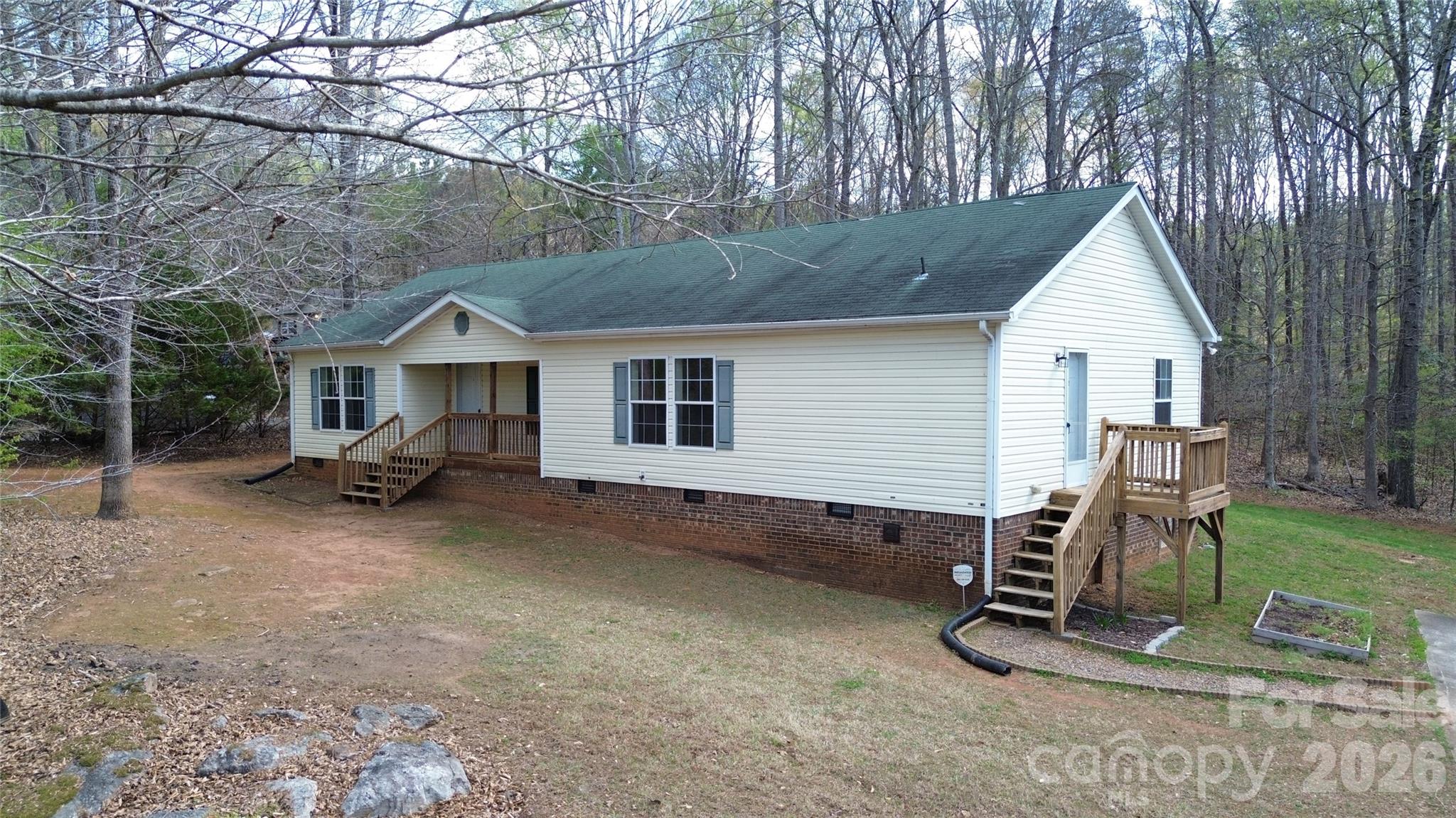 3441 Laboratory Road Lincolnton, NC 28092 - Photo 2 of 24 a view of a house with backyard porch and sitting area