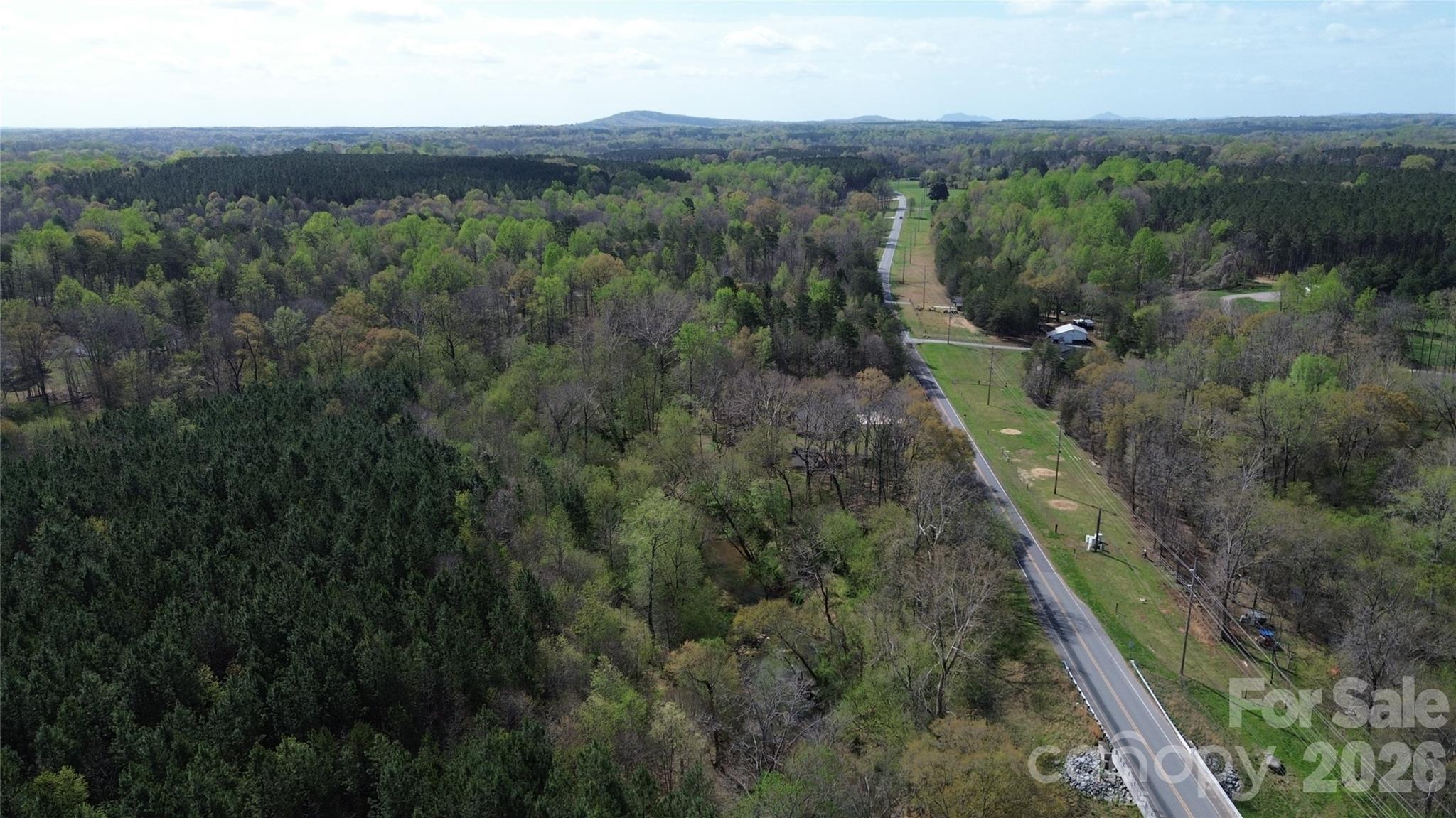 3441 Laboratory Road Lincolnton, NC 28092 - Photo 22 of 24 a view of a city with lush green forest