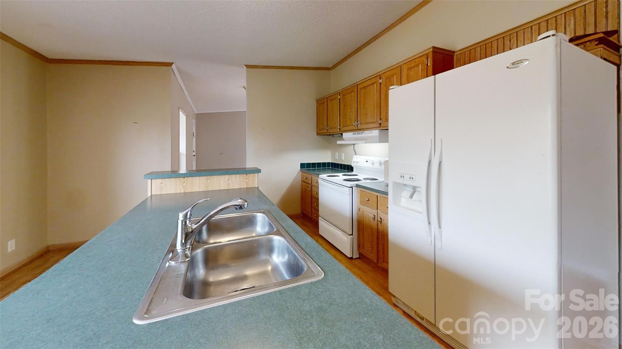 3441 Laboratory Road Lincolnton, NC 28092 - Photo 8 of 24 a kitchen with a refrigerator a stove and a sink
