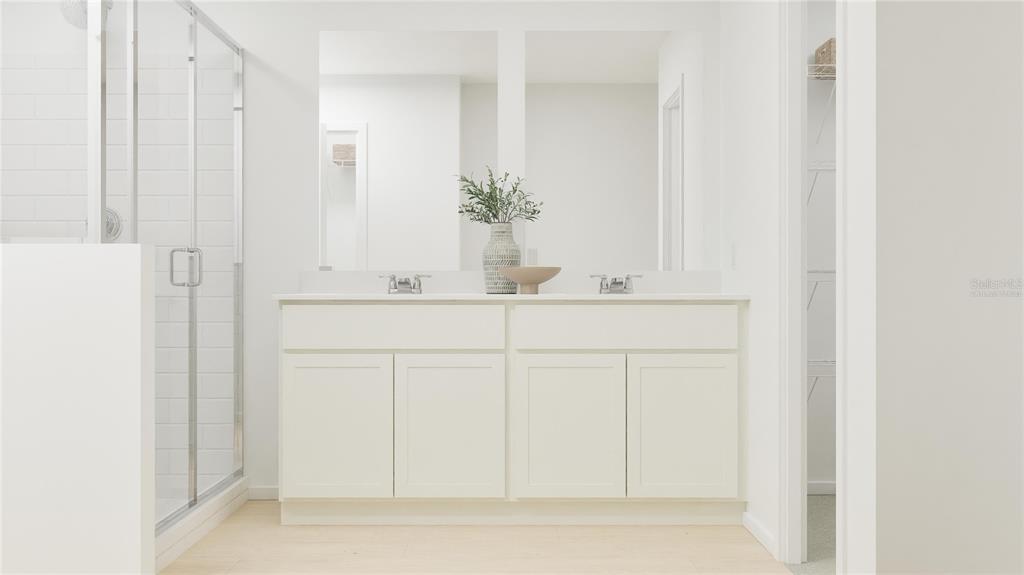 5198 Clay Whaley Road St. Cloud, FL 34772 - Photo 19 of 25 a bathroom with a sink and a mirror