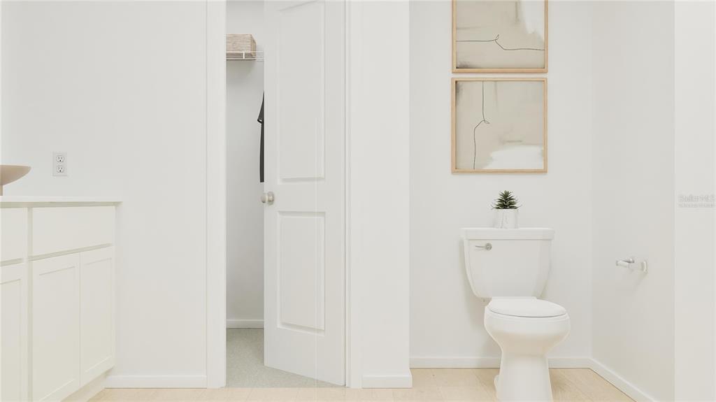 5198 Clay Whaley Road St. Cloud, FL 34772 - Photo 20 of 25 a bathroom with a toilet sink and a mirror