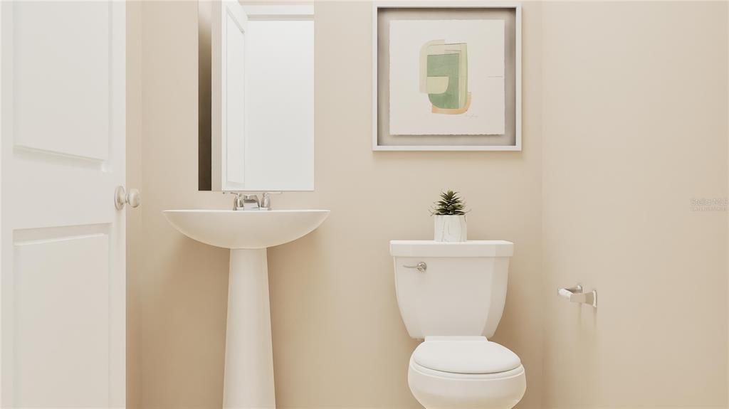 5198 Clay Whaley Road St. Cloud, FL 34772 - Photo 8 of 25 a bathroom with a toilet sink and mirror