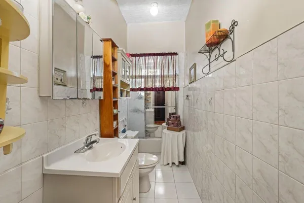 a bathroom with a sink and mirror