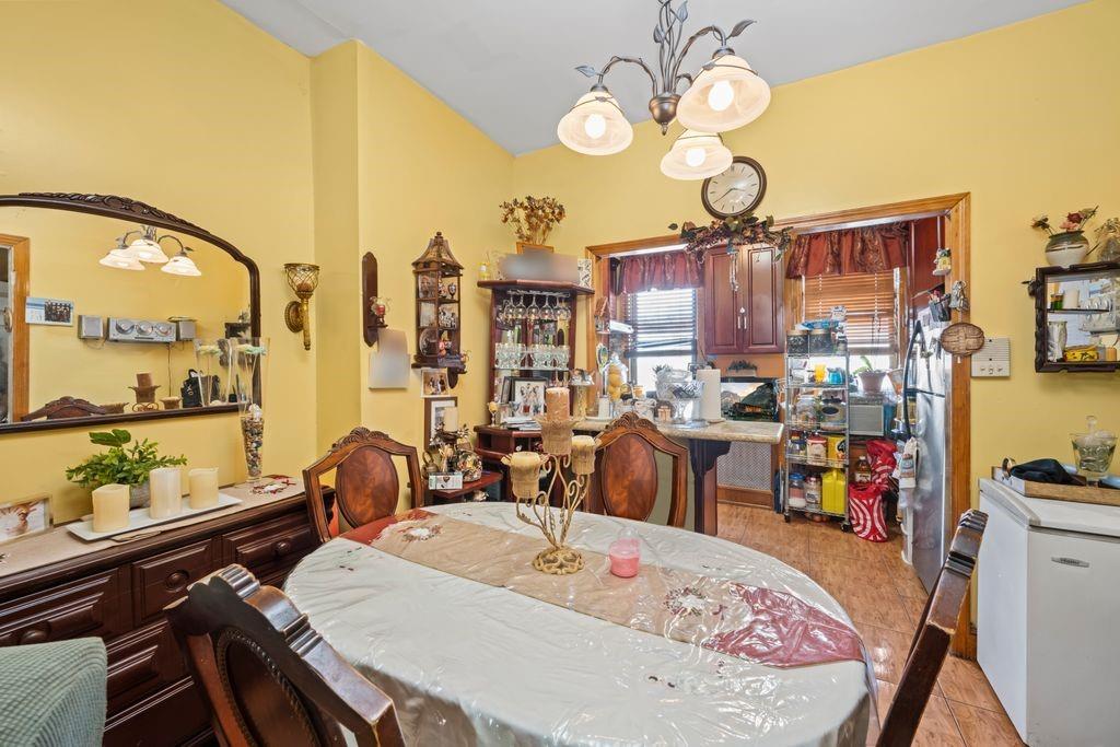 425 36th Street Brooklyn, NY 11232 - Photo 5 of 22 a large kitchen with a table and chairs