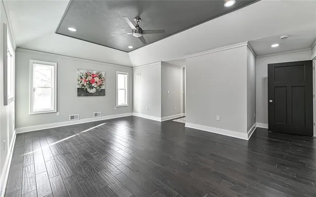 a bathroom with a double vanity sink a mirror and a bathtub