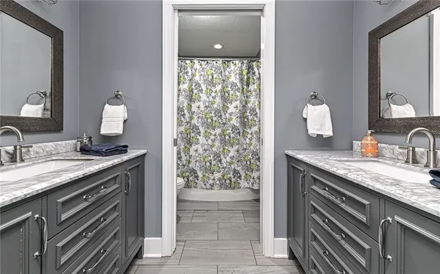 a kitchen with sink microwave and cabinets