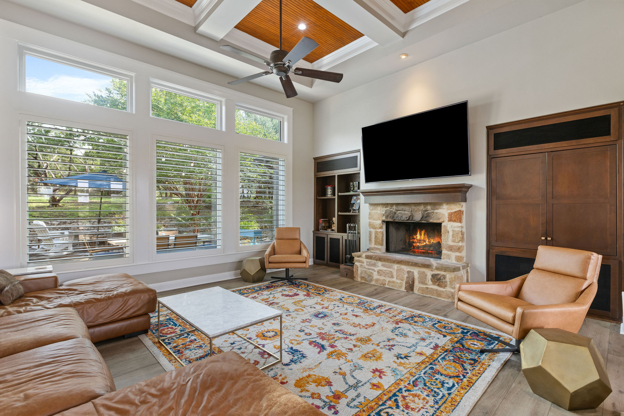 279 Rugged Earth Drive Austin, TX 78737 - Photo 6 of 40 a living room with furniture a flat screen tv and a fireplace