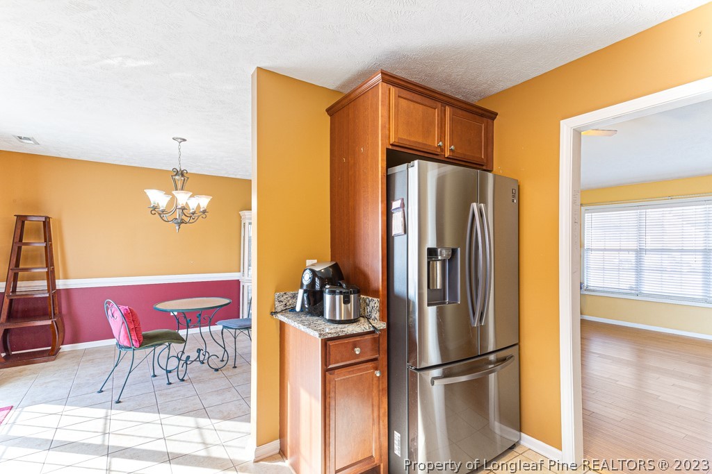 117 Ridgeview Drive Raeford, NC 28376 - Photo 14 of 31 a kitchen with stainless steel appliances granite countertop a refrigerator and a stove top oven