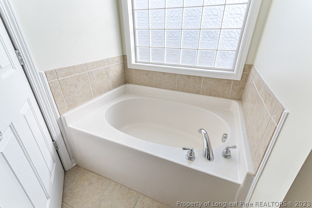 117 Ridgeview Drive Raeford, NC 28376 - Photo 20 of 31 a white bath tub sitting in a bathroom