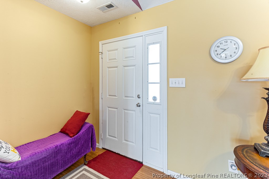 117 Ridgeview Drive Raeford, NC 28376 - Photo 6 of 31 a living room with furniture and a table