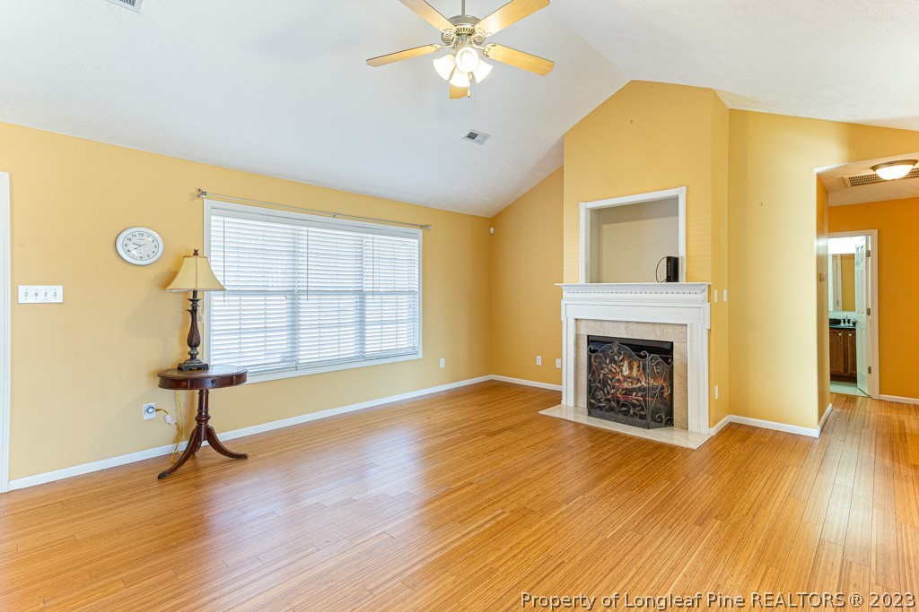 117 Ridgeview Drive Raeford, NC 28376 - Photo 9 of 31 a view of an empty room with wooden floor and a window