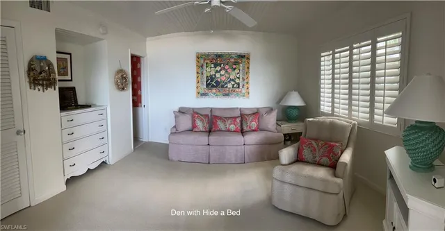 a living room with furniture and window