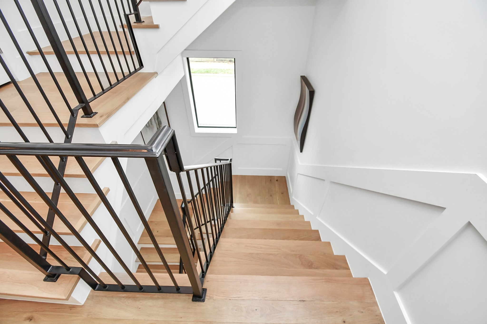 2303 Yupon Street Houston, TX 77006 - Photo 13 of 48 a view of staircase with white walls and a window