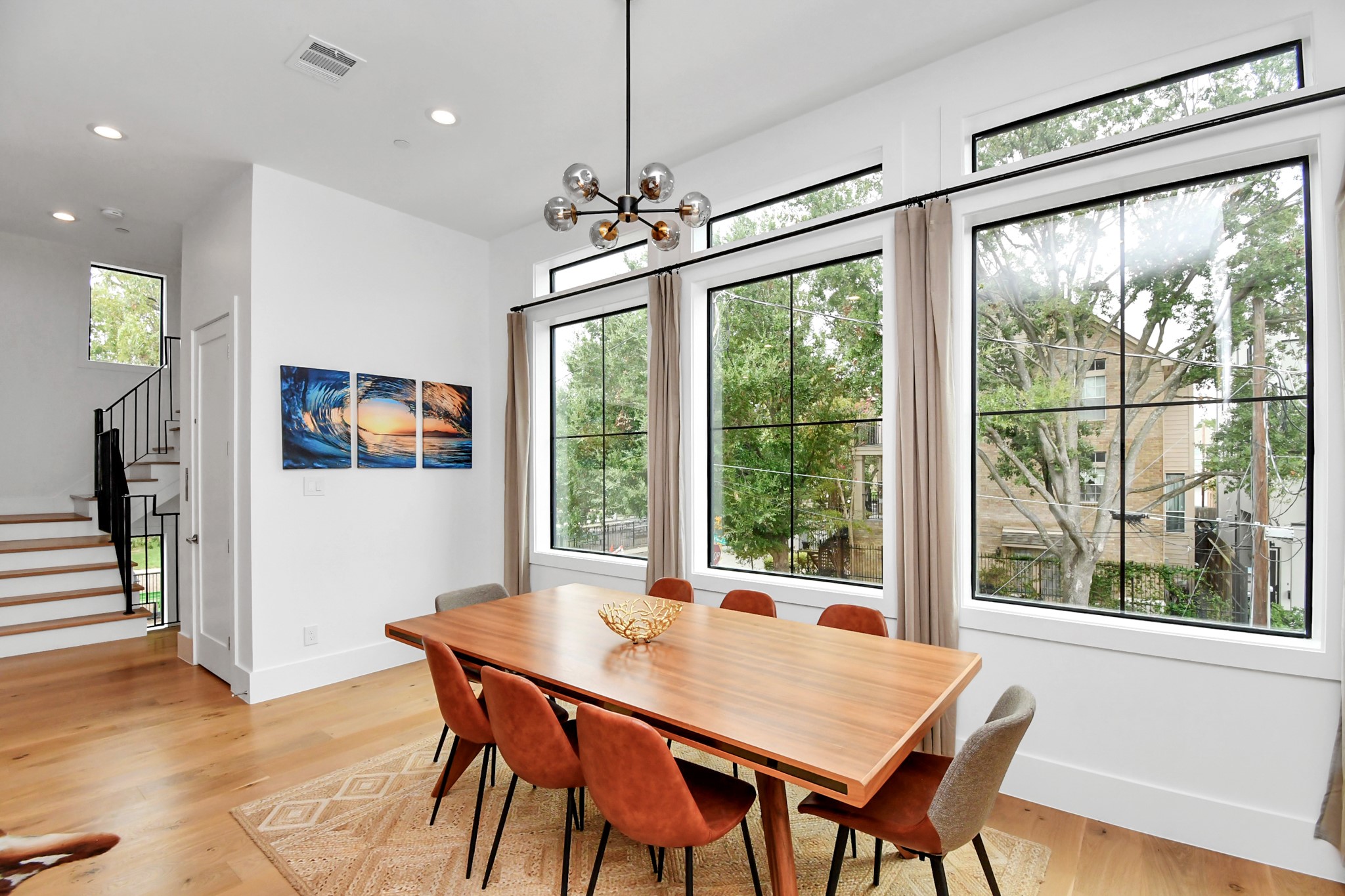 2303 Yupon Street Houston, TX 77006 - Photo 26 of 48 a view of a dining room with furniture window and wooden floor