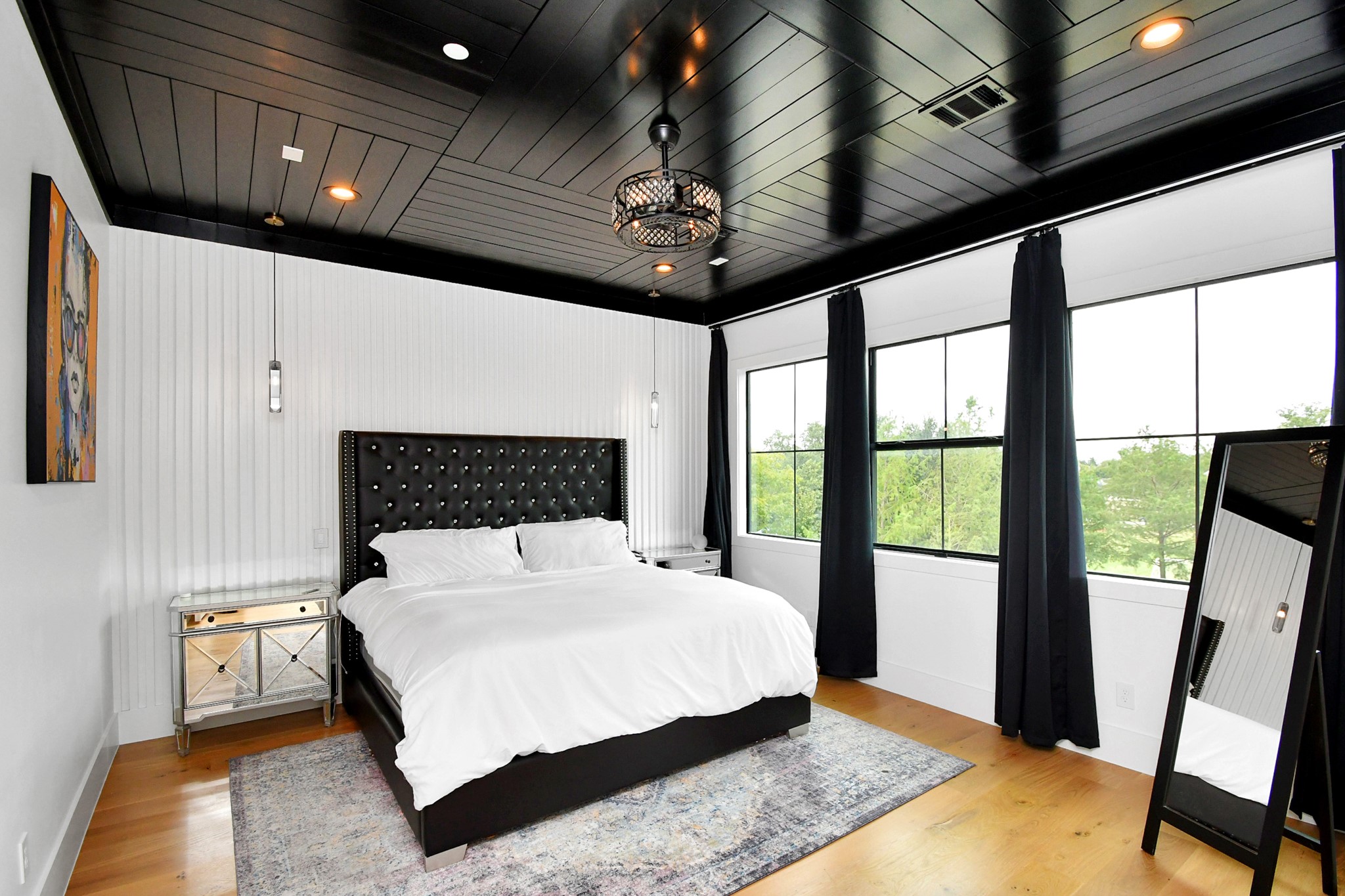2303 Yupon Street Houston, TX 77006 - Photo 30 of 48 a bedroom with a large bed and a large window