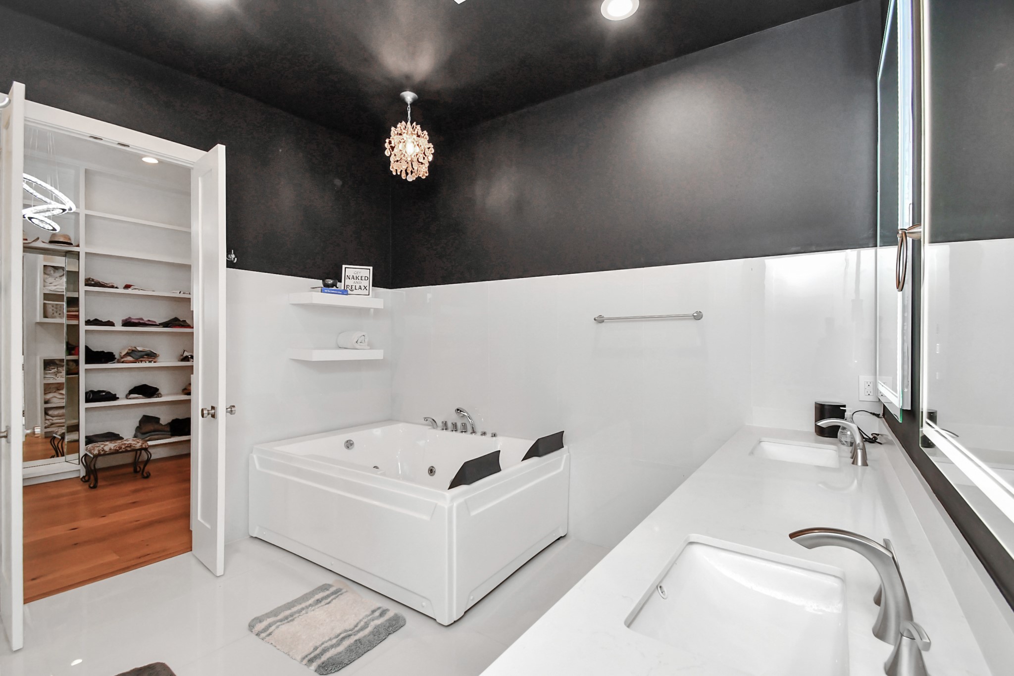 2303 Yupon Street Houston, TX 77006 - Photo 35 of 48 a bathroom with a sink a large mirror and shower