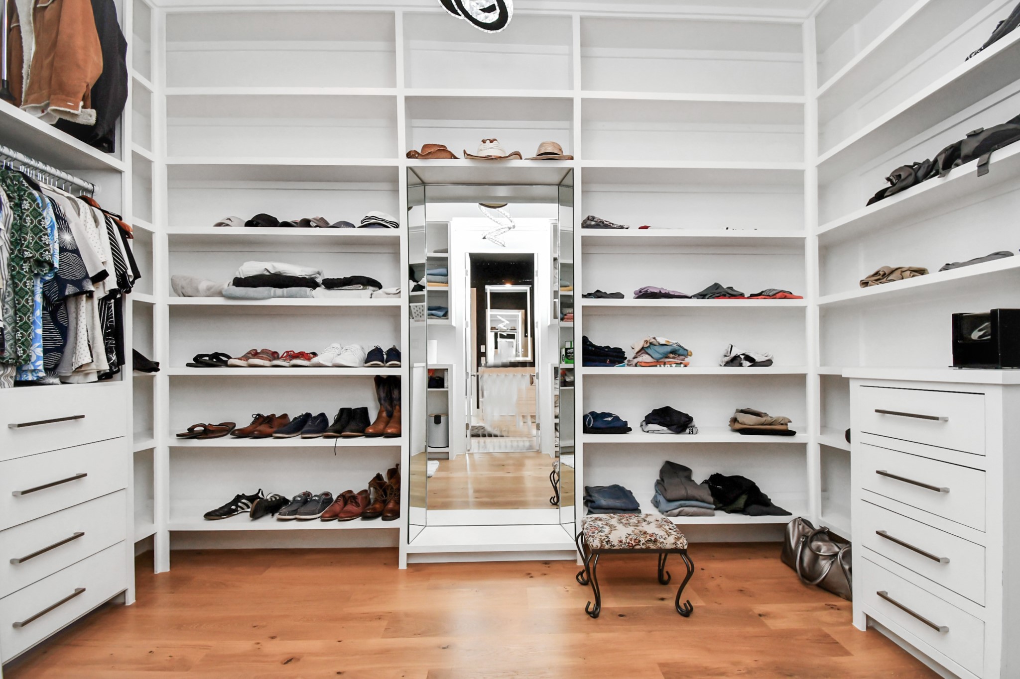 2303 Yupon Street Houston, TX 77006 - Photo 37 of 48 a view of walk in closet with clothes and shoes