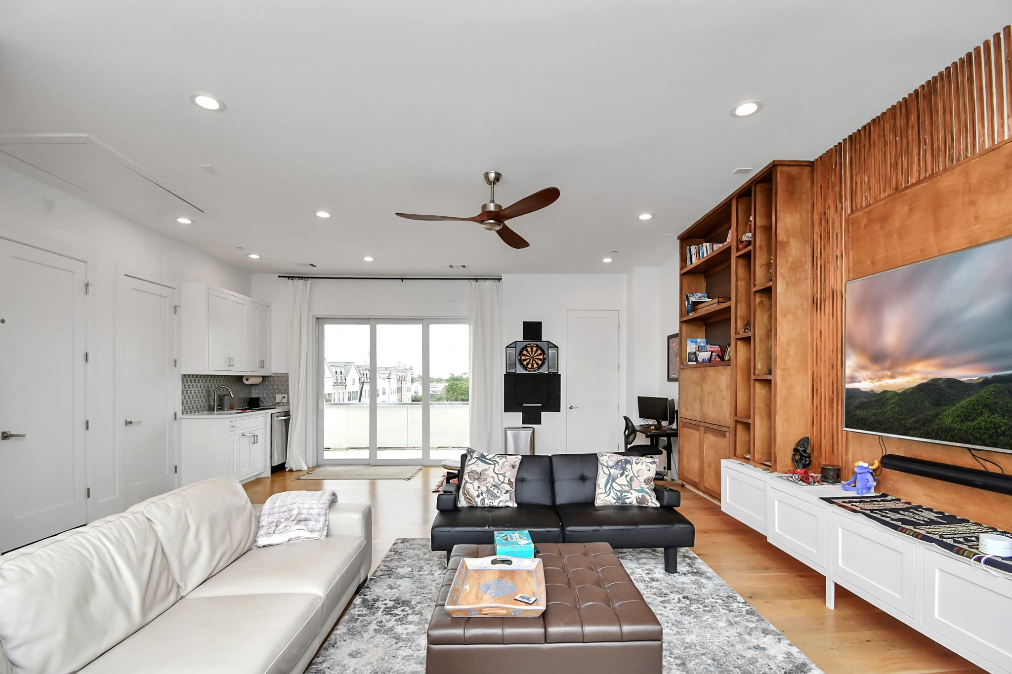 2303 Yupon Street Houston, TX 77006 - Photo 45 of 48 a living room with furniture and a flat screen tv