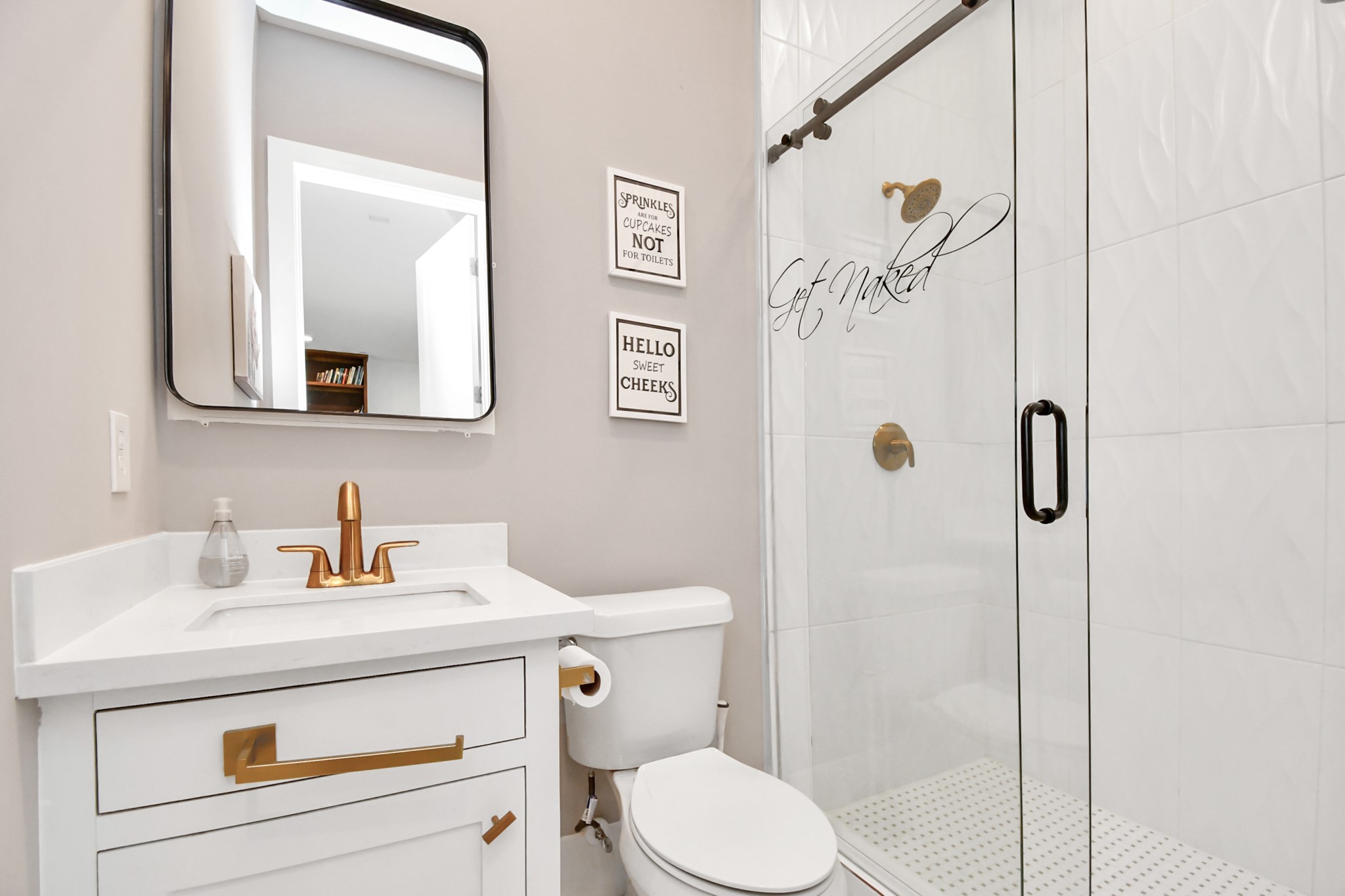 2303 Yupon Street Houston, TX 77006 - Photo 47 of 48 a bathroom with a sink a toilet and a mirror