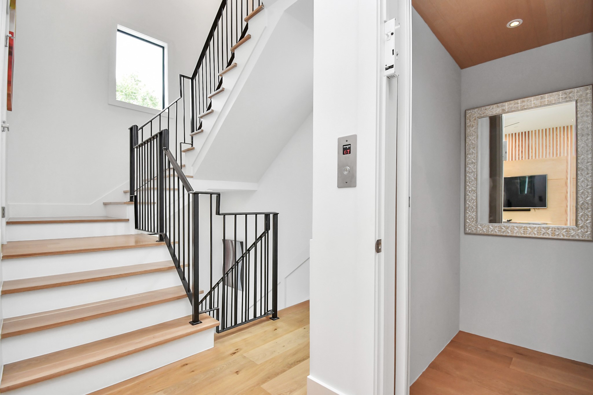 2303 Yupon Street Houston, TX 77006 - Photo 8 of 48 a view of staircase with white walls and a window