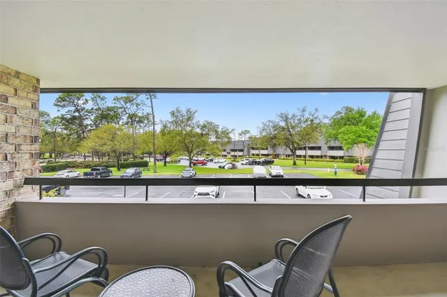 a view of swimming pool with outdoor seating and city view