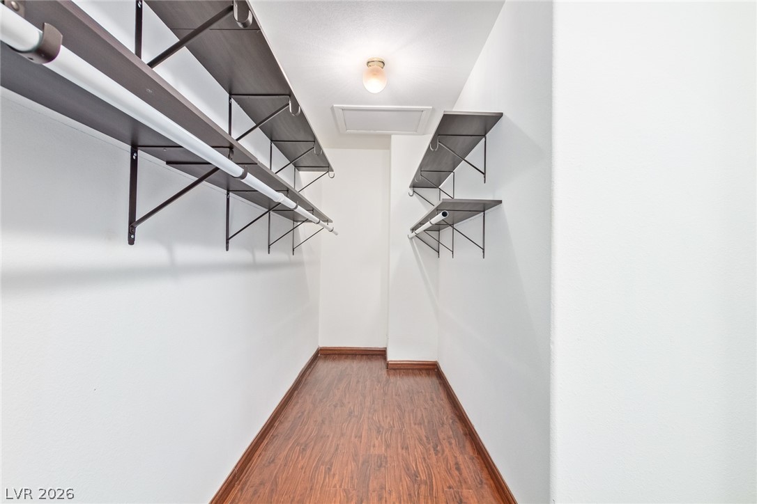 1477 Rancho Ridge Drive Henderson, NV 89012 - Photo 24 of 46 A generously sized walk-in closet with ample shelving and hanging space.