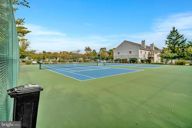a view of a house with a swimming pool and a yard